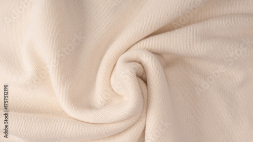 Soft milky color merino wool sweater texture as a background.