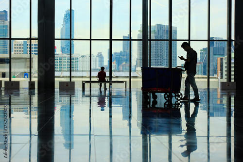 silhouettes of people in airport