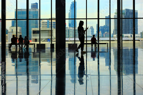 silhouettes of people in airport