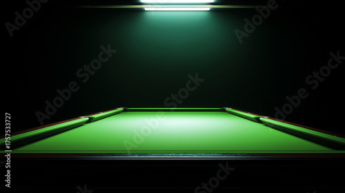 Green snooker table under spotlight in dark billiard room