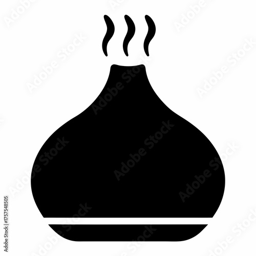 Elegant black essential oil diffuser with rising mist for aromatherapy comfort