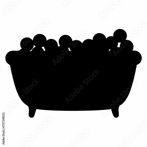 Silhouette of a bathtub filled with many bath bombs or bubbles