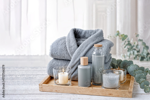 Minimalist spa set with bodycare products and bathrobe for wellness advertising