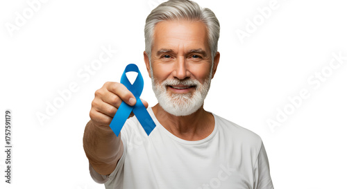 Middle-aged man holds and offers the blue ribbon, the international symbol of prostate cancer prevention.