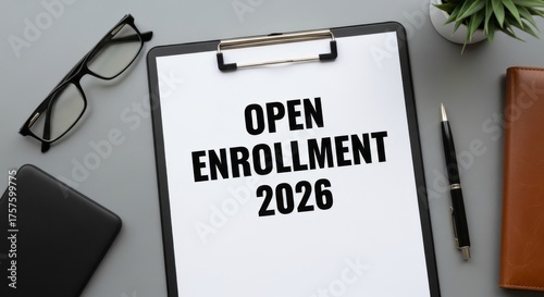 Open Enrollment 2026 Notice Clip Board on a Desk with Accessories Still Life