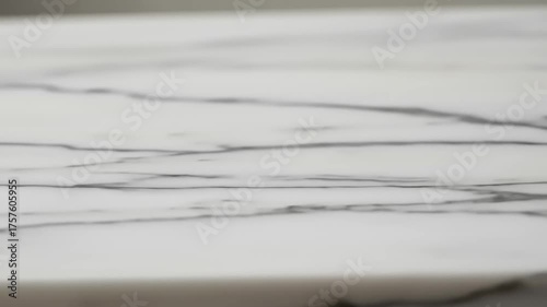 Close-up view of elegant marble surface showcasing natural veining patterns, ideal for design projects