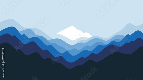 Layered blue mountains with a white peak in the distance against a light blue sky backdrop viewscape