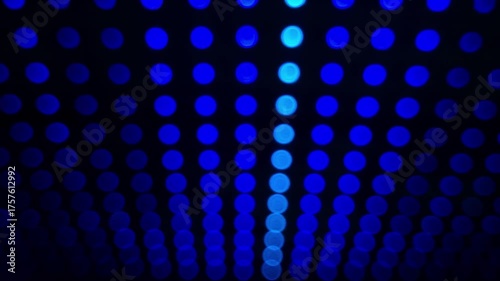 Defocused bokeh background with colorful LED lights at the night club