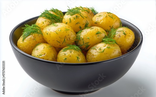 Freshly Cooked Potatoes With Herbs Served in a Black Bowl on a White Background