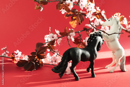 Two horses with plum flowers around him. Chinese New Year 2026.
