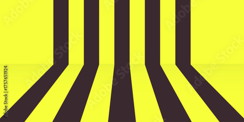 An empty urban street with bold yellow lines creating a striped background for traffic direction on the asphalt road