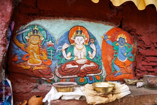 Colorful carved mural depicting Buddhist deities inside Tradruk Temple in Tsetang, Lhoka (Shannan), Tibet, showcasing sacred Tibetan art and traditional Himalayan craftsmanship.