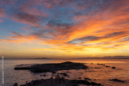 Dazzling sunset from Tabarca Island with Santa Pola in front in Alicante, Spain