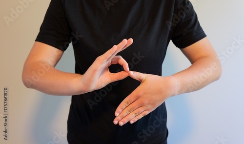 Bild auf Leinwand What is the Six Seven 6-7 Slang Trend - Girl Demonstrates Popular Hand Gestures