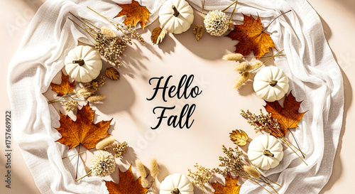 A festive autumn wreath with white pumpkins, dried leaves, and a 'Hello Fall' sign, perfect for seasonal decor.