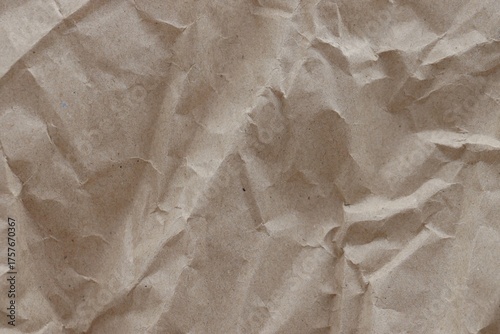 Brown crumpled recycled paper texture background. Kraft Paper