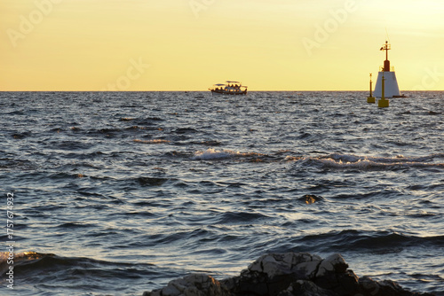 Beautiful sunset at the Adriatic Sea with waves