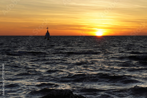 Beautiful sunset at the Adriatic Sea with waves