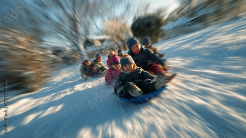 Children Having Fun Sledding Down a Snowy Hill During Winter Afternoon