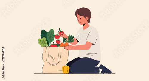 Young Man Packing Groceries Into Reusable Eco Friendly Bag