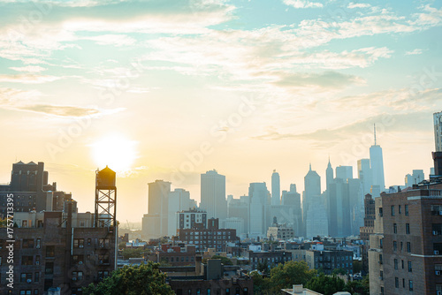 View of financial district Manhattan skyline and Brooklyn buildings at sunset