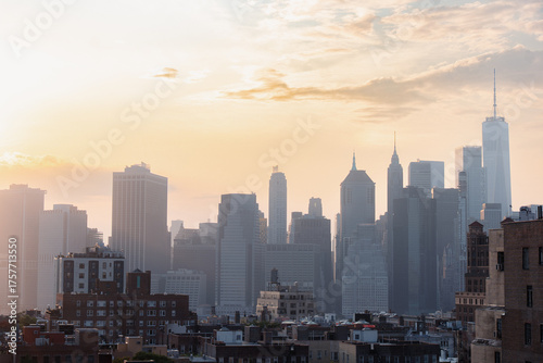 View of financial district Manhattan skyline and Brooklyn buildings at sunset