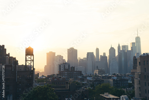 View of financial district Manhattan skyline and Brooklyn buildings at sunset