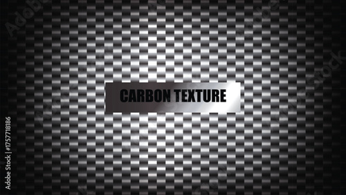 Abstract dark carbon fiber texture background with a metallic label in the center