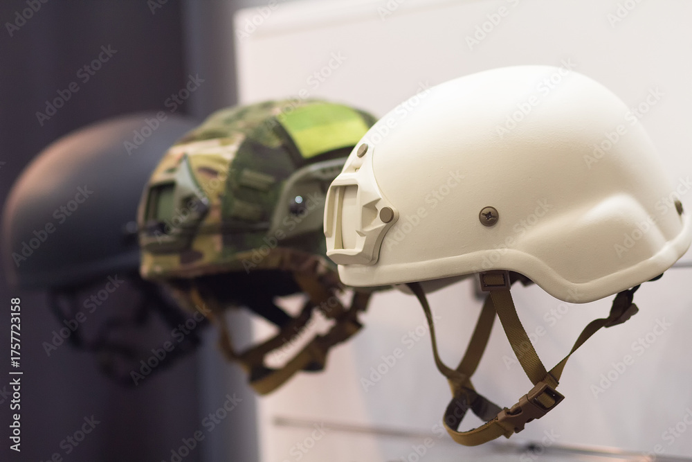 Fototapeta premium Modern tactical military helmets in showcase