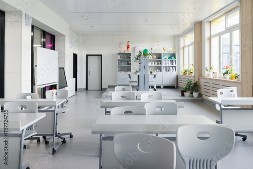 Bright Modern Classroom Interior with Desks, Chairs and Natural Light