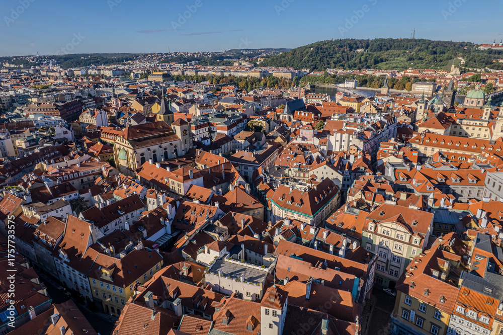 Obraz premium Beautiful view of St. Nicholas Church in Prague’s Old Town Square, surrounded by historic buildings and vibrant city life in the heart of the Czech capital.