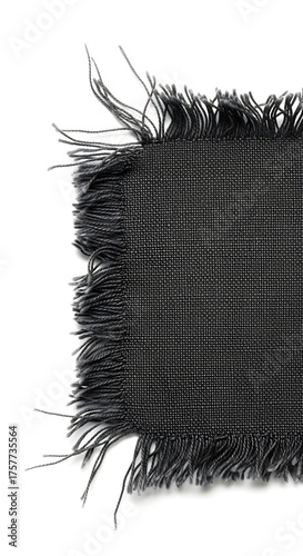 Close-up of frayed black fabric edge, showcasing textile texture and rough unfinished threads on white background