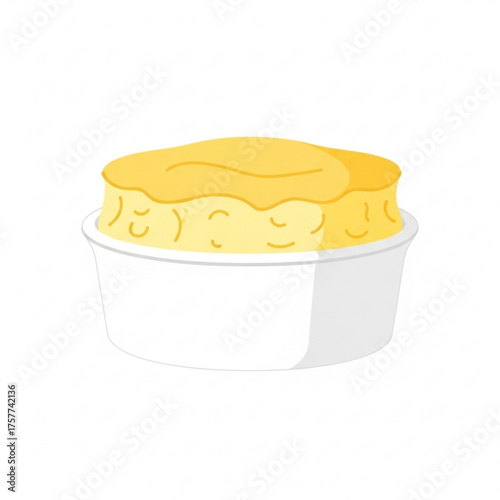 Lemon soufflé in a white ramekin on plain background  