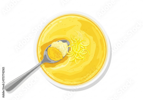 Creamy lemon soufflé served in a bowl with a spoon  