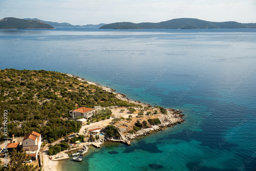 Naklejka premium Adriatic cove with rocky headland aerial view