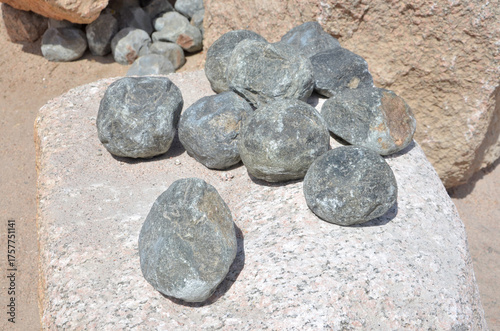 Stone balls of doleryt volcanic rock for chipping tool of granite processing in the Aswan Red Granite Quarry, Egypt
