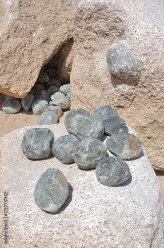Stone balls of doleryt volcanic rock for chipping tool of granite processing in the Aswan Red Granite Quarry, Egypt