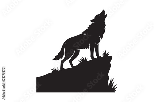 Silhouette of a wolf howling on a rocky cliff