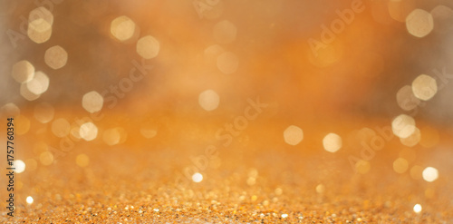 Sparkling golden bokeh background with shimmering lights creating a festive atmosphere