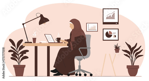 A focused Muslim woman in a hijab efficiently works on her laptop within her modern home office, surrounded by plants and framed business analytics.
