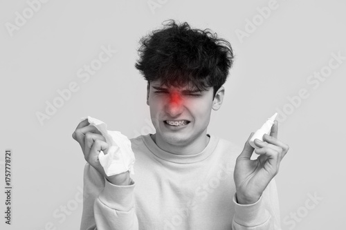 Young man with runny nose h...