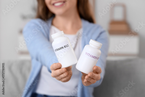Young woman with vitamin B ...
