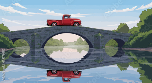 Nostalgic red pickup truck traverses old stone bridge over reflective river