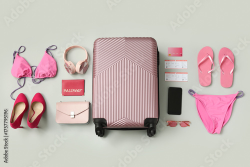 Pink suitcase, swimsuit and...