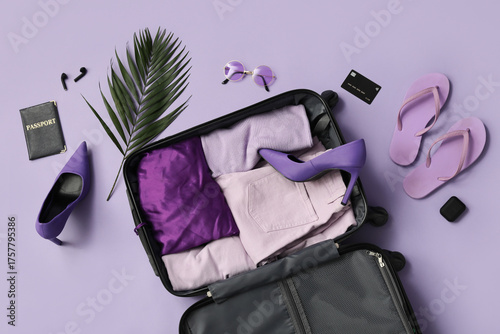 Packed suitcase with clothe...