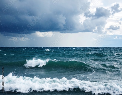 Dramatic Seascape Featuring Turbulent Teal Waters Underneath Overcast Sky with Rain Storm