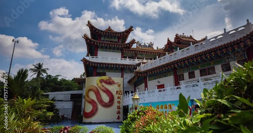 Kuala Lumpur, Malaysia – October 13, 2025: Time lapse of Thean Hou Temple courtyard decorated with hundreds of lanterns, visitors walking and clouds moving above