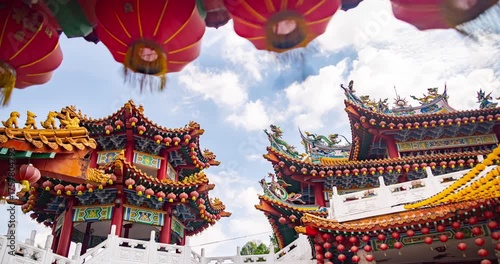 Kuala Lumpur, Malaysia – October 13, 2025: Time lapse of Thean Hou Temple courtyard decorated with hundreds of lanterns, visitors walking and clouds moving above