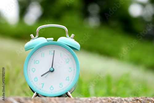 Blue alarm clock on pavemen...