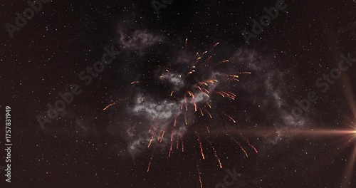 Illuminating fireworks explosion arching golden spark trails in night sky, smoke clouds, lens flare